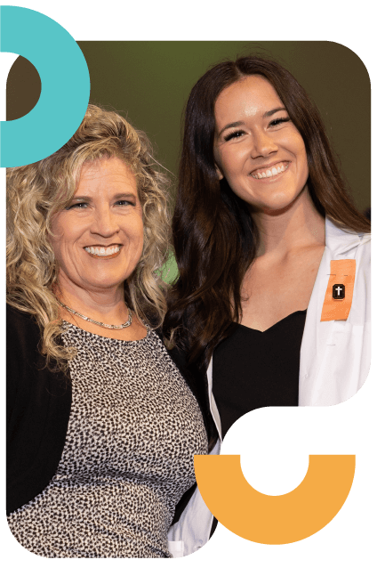 Young nurse smiling after graduating.